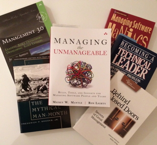 Photo of books that provide training for development managers.
